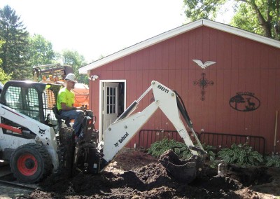 Our technicians begin the process of installing the new water well pump system by digging a trench alongside the new water well.