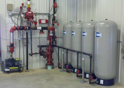 Pressure tanks are set up inside a building with VFD and Fire Protection equipment